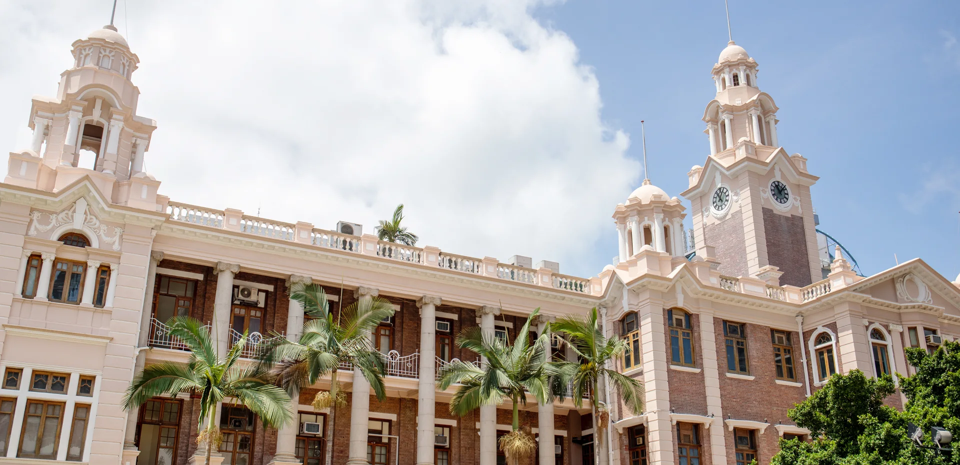 The historic HKU Main Building beneath a clear sky
